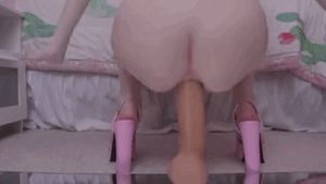 Jumping on big dildo