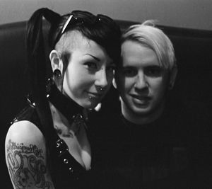 Paraquat Suicide is pure goth in classy black & white as this creepy dude is creepin on her oh so cute teenage face and cleavage- SGB gothh