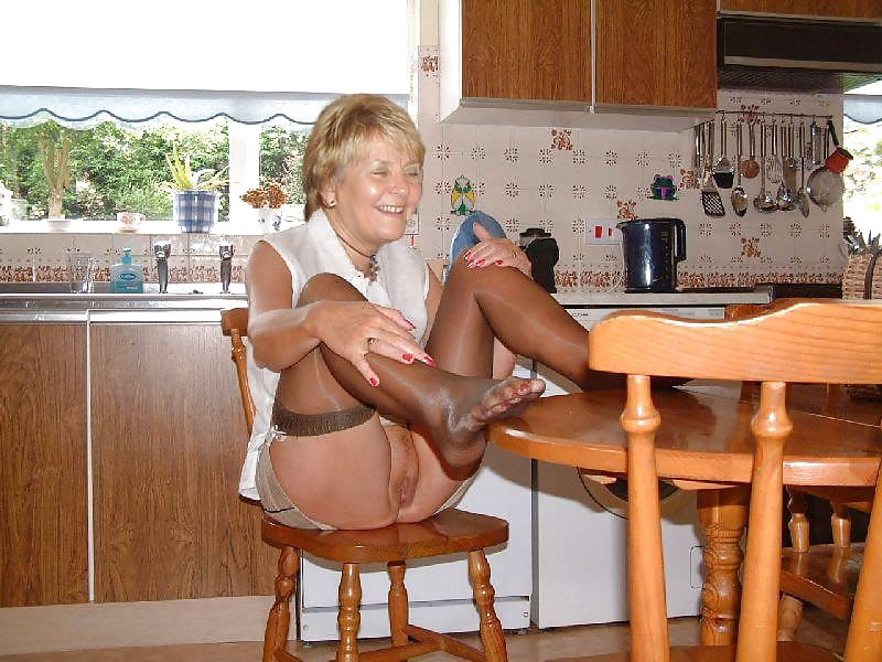 GILF Spread sitting in chair