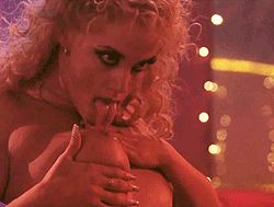 Elizabeth Berkely licks her nipple