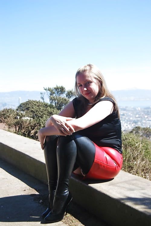 cute blonde outdoors in latex dress