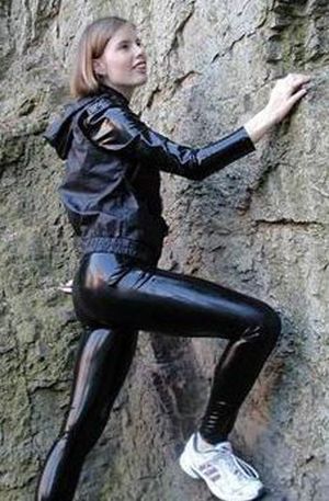 shy confident woman in shiny leggings