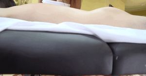 Eva Notty under the massage table.