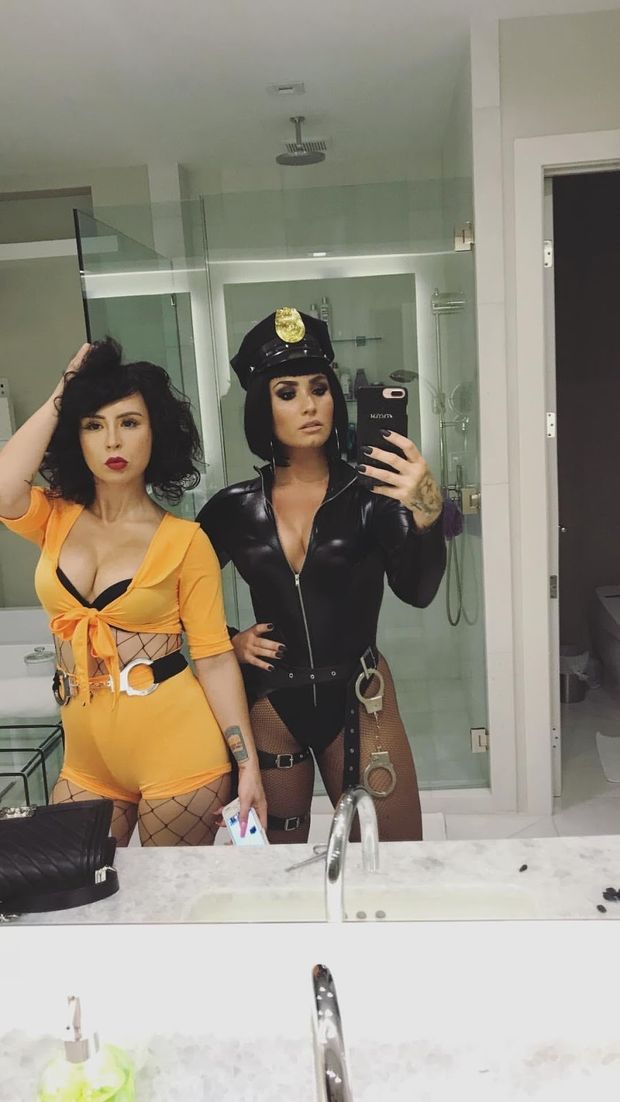 Singer/Actress Demi Lovato dressed as a Hot cop with some friend on Halloween 2017 mirror selfie