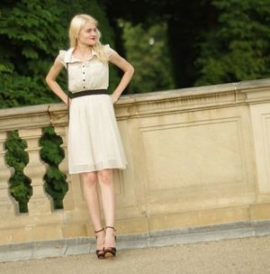 Real insta amateur posing outdoors in sexy dress and heeled sandals