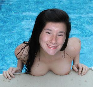 Amy topless in the hotel pool