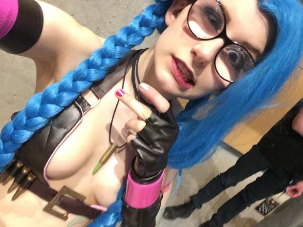 A yung teenage Alabama FireCracker is in goth cosplay & blue hair as everything that is cheap and tawdry