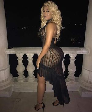 Asian posing in a evening dress.