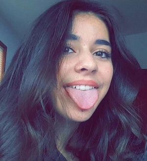 Adorable face with tongue sticking out.