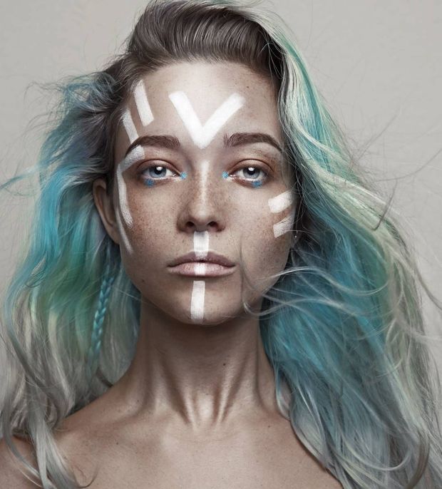 Beautiful woman with tribal facepaint