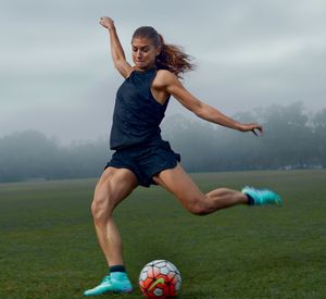 Alex Morgan muscular legs mid kick