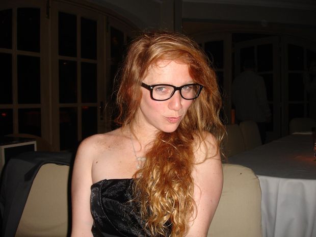 Tempting redhead with glasses