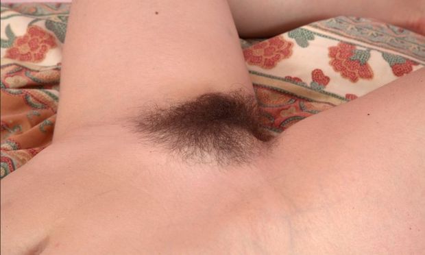 Olga Cabaeva is proud of her lush, hairy pussy.
