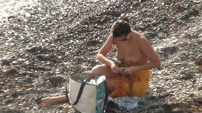 Topless babe on the beach
