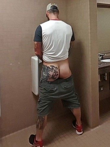 Tatted Daddy booty at the urinal