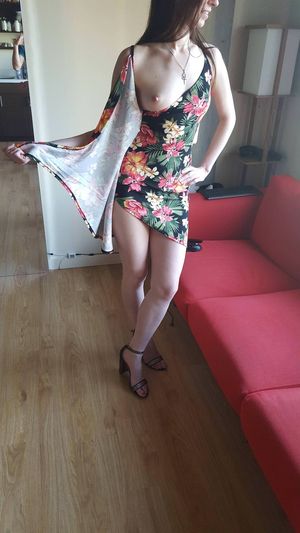 sexy brunette in tight dress flashing her tits with sexy legs and ankle strap heels