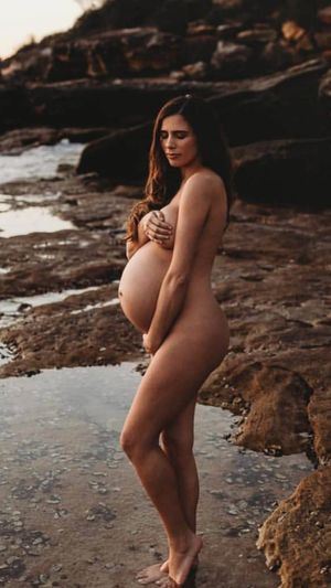 sexy pregnant brunette naked outside hand bra