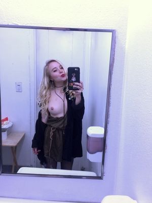 cute blonde dressing room selfie flashing her tits