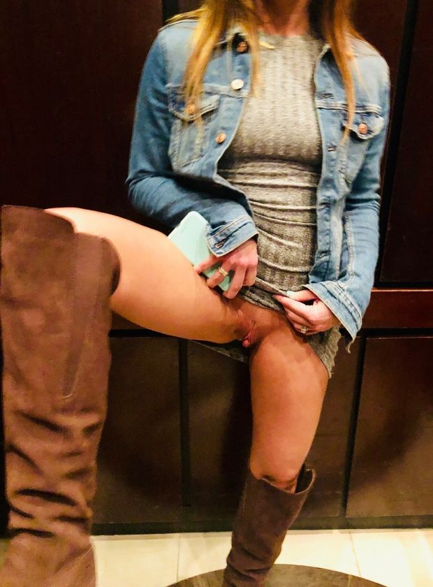 woman in knee high boots with no panties under dress flashing her pussy in elevator
