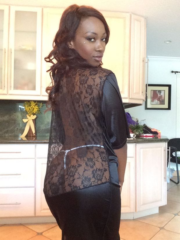 sexy black woman in string thong and silk robe