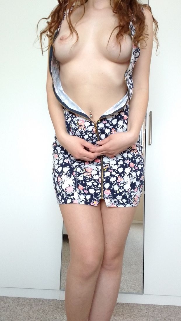flashing her perky tits in her flower dress