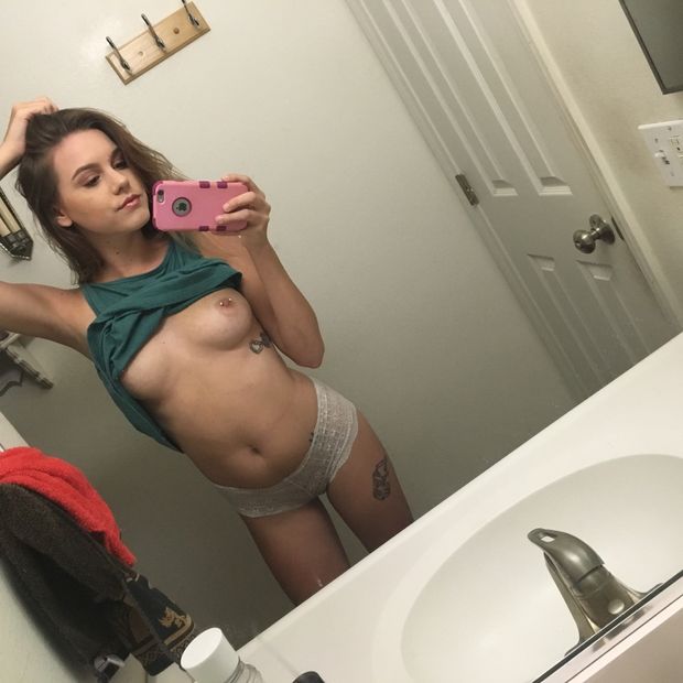 cute brunette in panties flashing her pierced tits selfie