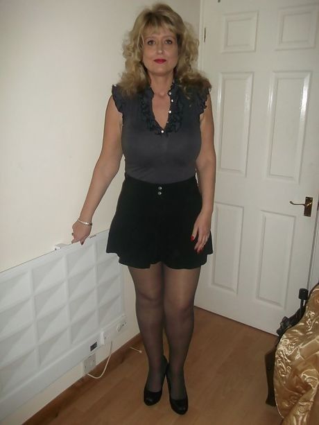 Mommy poses in her outfit at home