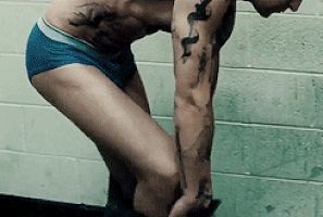 stripping tattooed guy
