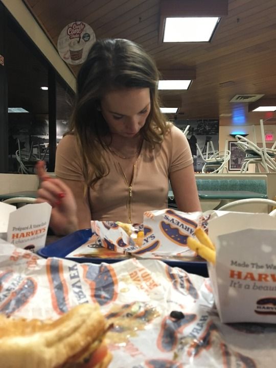 brunette with pokies in public restaurant
