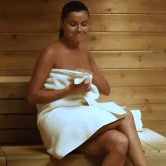 gif - brunette stripping off her towel naked in sauna