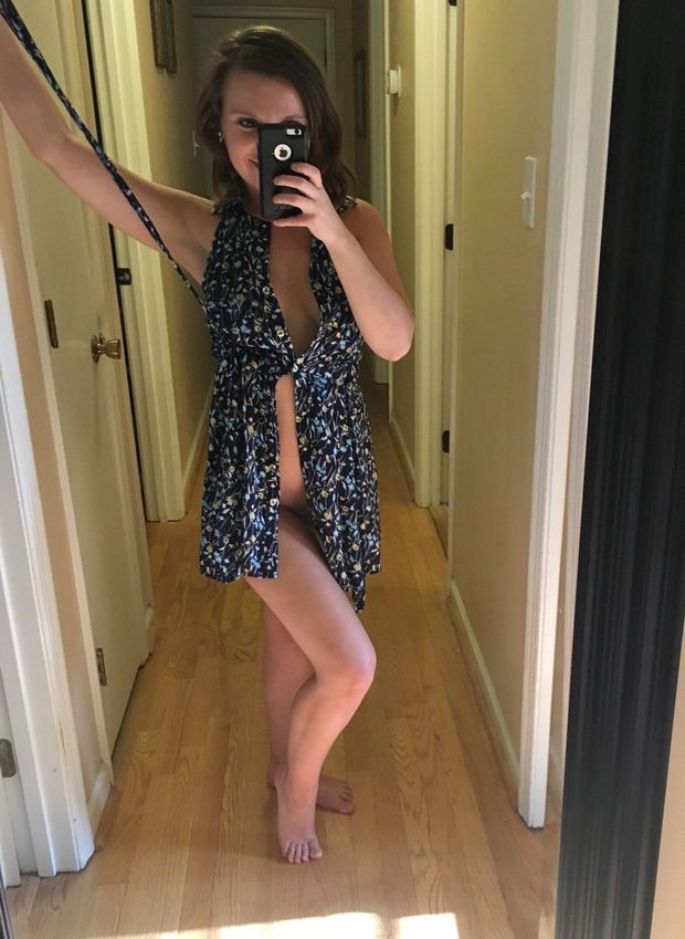 cute brunette teasing in dress