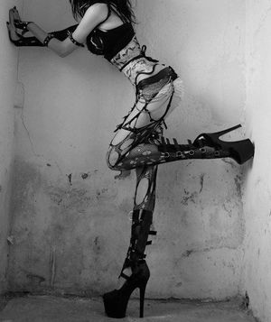 Trashy fishnet outfit and heels