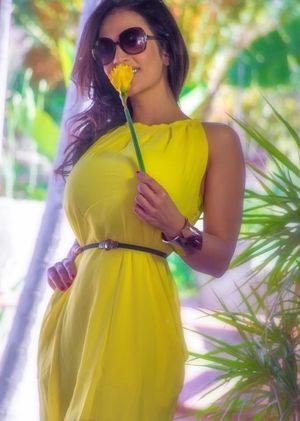 Denise Milani aka Denisa Krajickova is a yellow dress