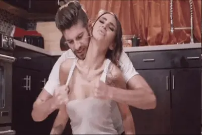 Tearng her shirt off