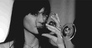 She knows exactly why he’s offering her wine