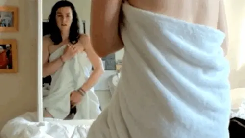 masturbating in front of a mirror