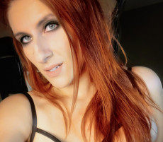 Dominating Redhead in Leather