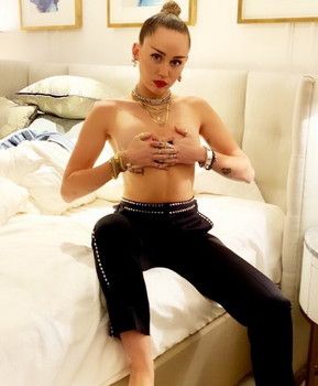 Miley Cyrus topless hand bra