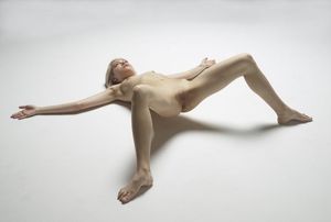 Nude blonde on back with legs spread wide