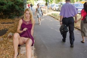 Blonde in public poses to allow view up her dress