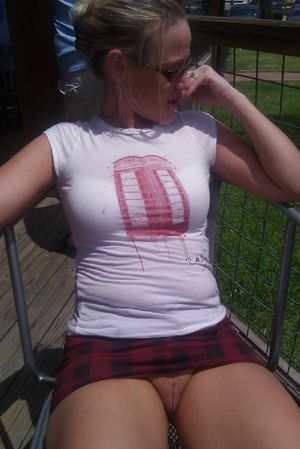 Babe flashing fat pussy in public