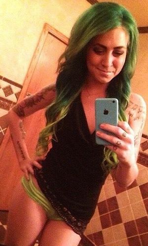 Green Haired chick showing off her matching panties.