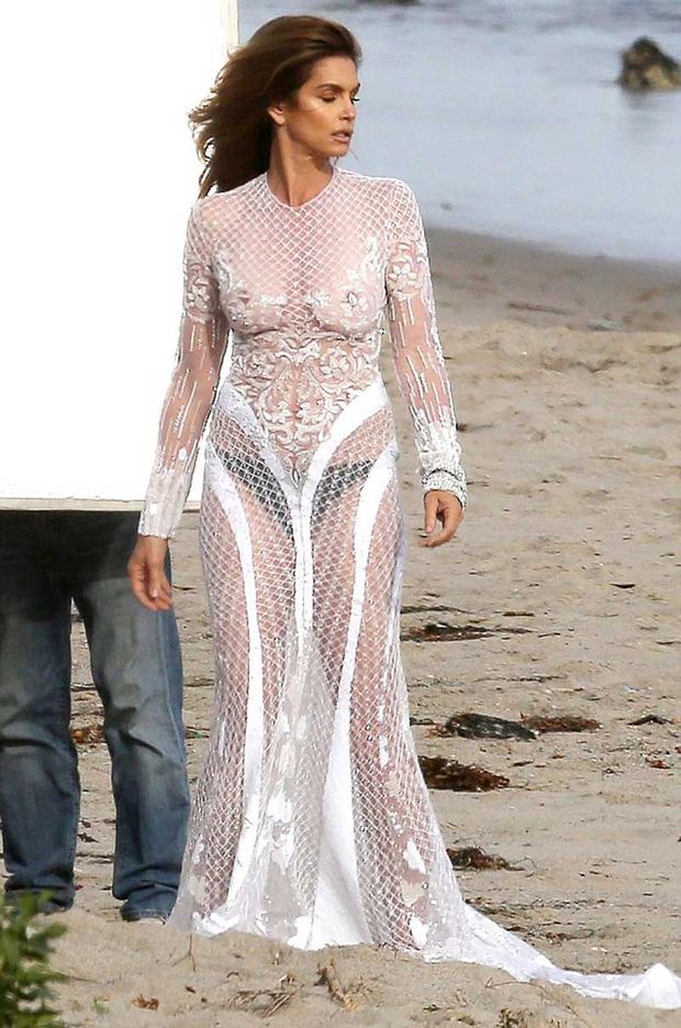 Cindy Crawford Braless in Lace Dress on the Beach