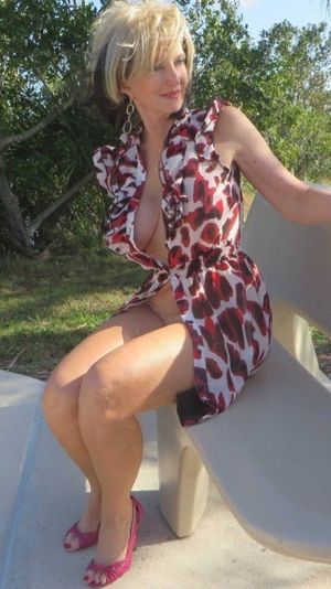 Sexy milf in revealing dress