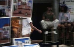 Vintage Porn Movie scene Streetwalker with pigtails in booty shorts