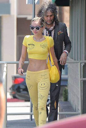 Miley Cyrus Braless in See Through Belly Shirt