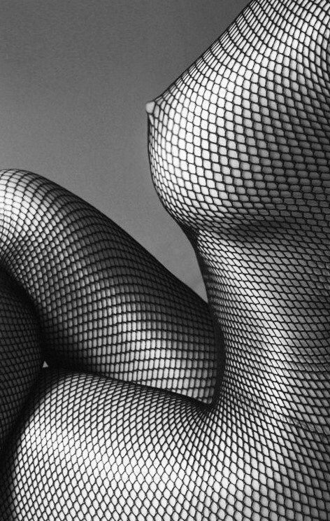 Nipple peeking though the net