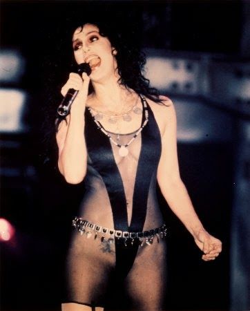 Cher Bono singing in a sexy outfit.
