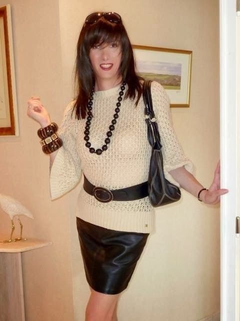 fashionable CD in leather skirt, yummy.