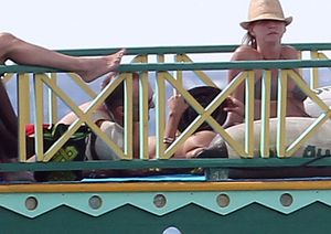 Rosario Dawson Caught Topless Sunbathing